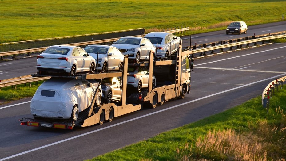 Highway view with car carriers on the move
